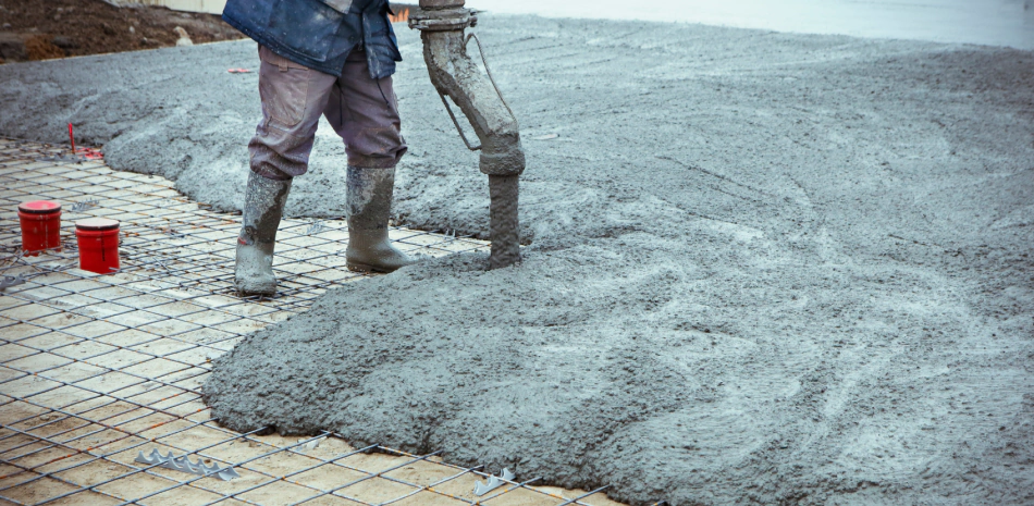 man pouring concrete