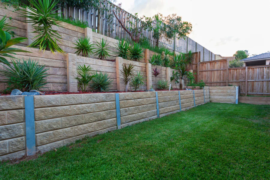 concrete retaining wall with beautiful plants and landscape